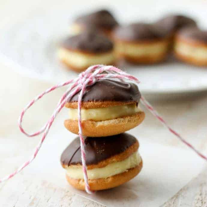 two stuffed cookies stacked on each other and tied with pink and white baker's twine