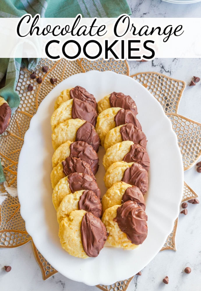 white platter of orange cookies dipped in chocolate; text label reads Chocolate Orange Cookies