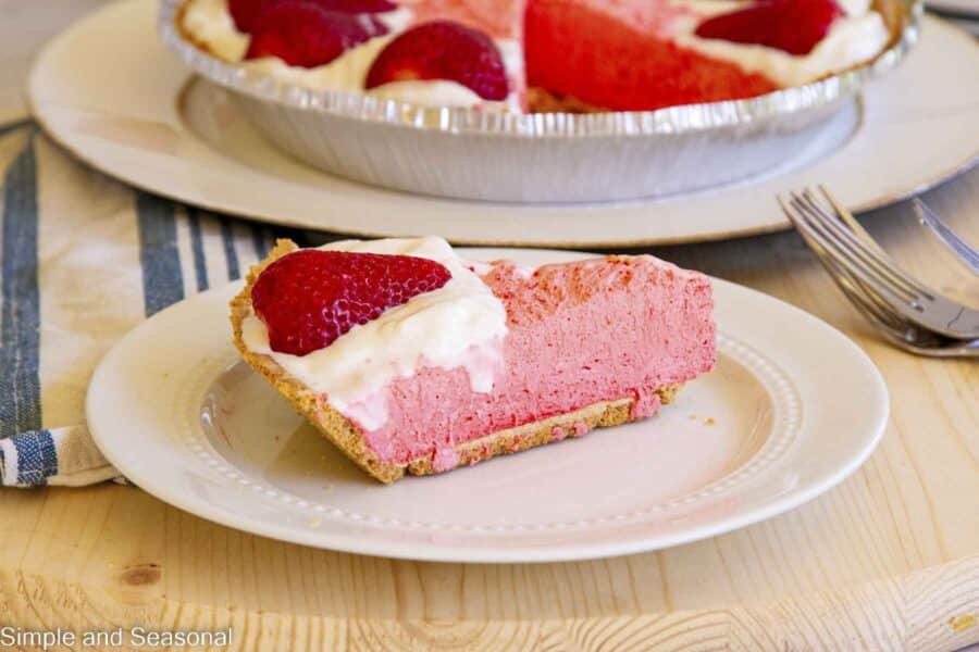 Slice of kool-aid pie on a white plate