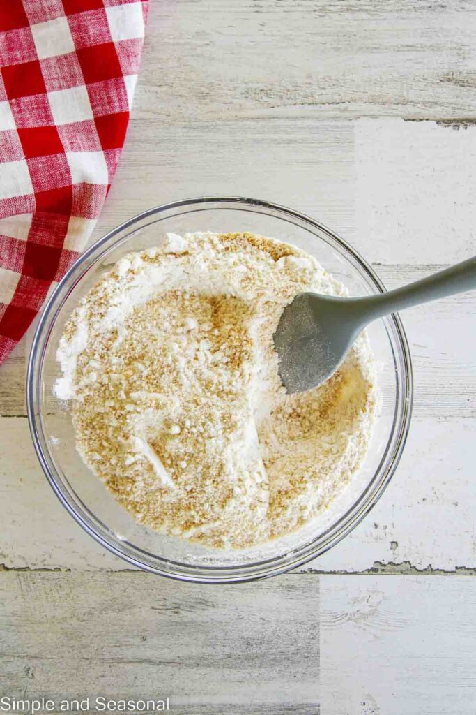 cookie mix and graham cracker crumbs mixed together with a spatula