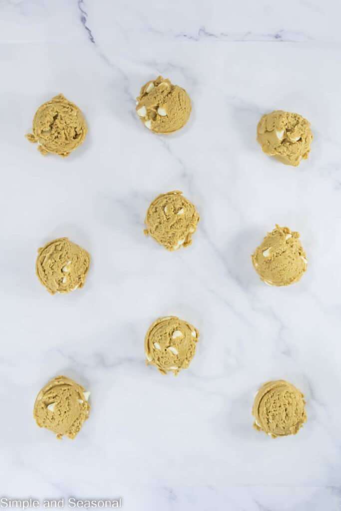 cookie dough balls laid out ready for baking