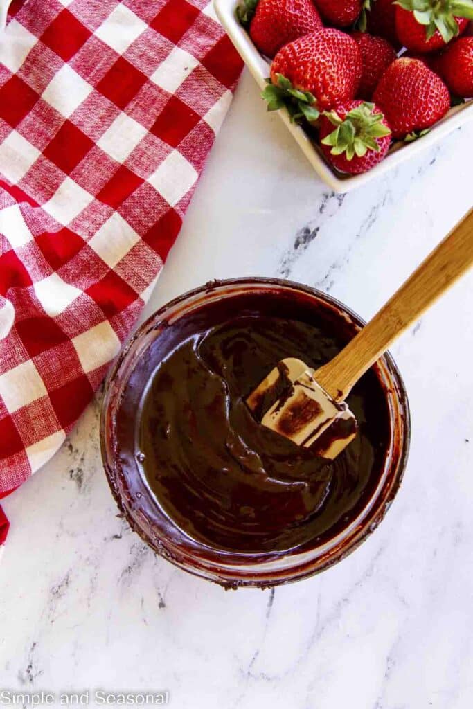 melted chocolate in a bowl with a spatula
