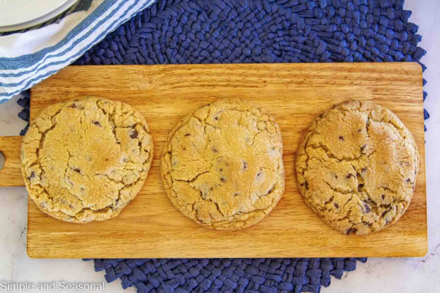 baked chocolate filled cookies on a wooden board
