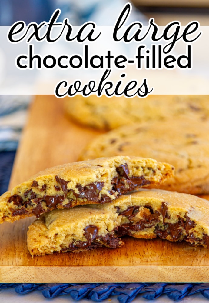 cookie split in half on a cutting board with whole cookies in the background