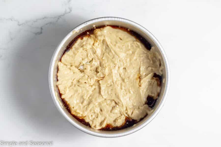 cake batter topping the pecan mixture