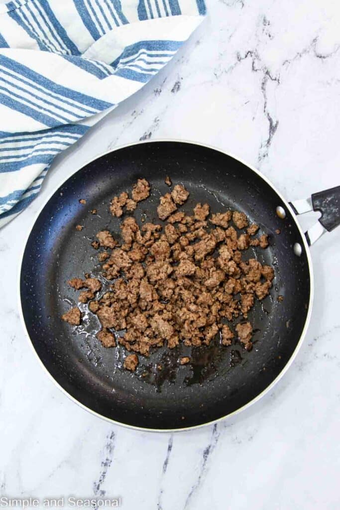 browned ground beef in a frying pan