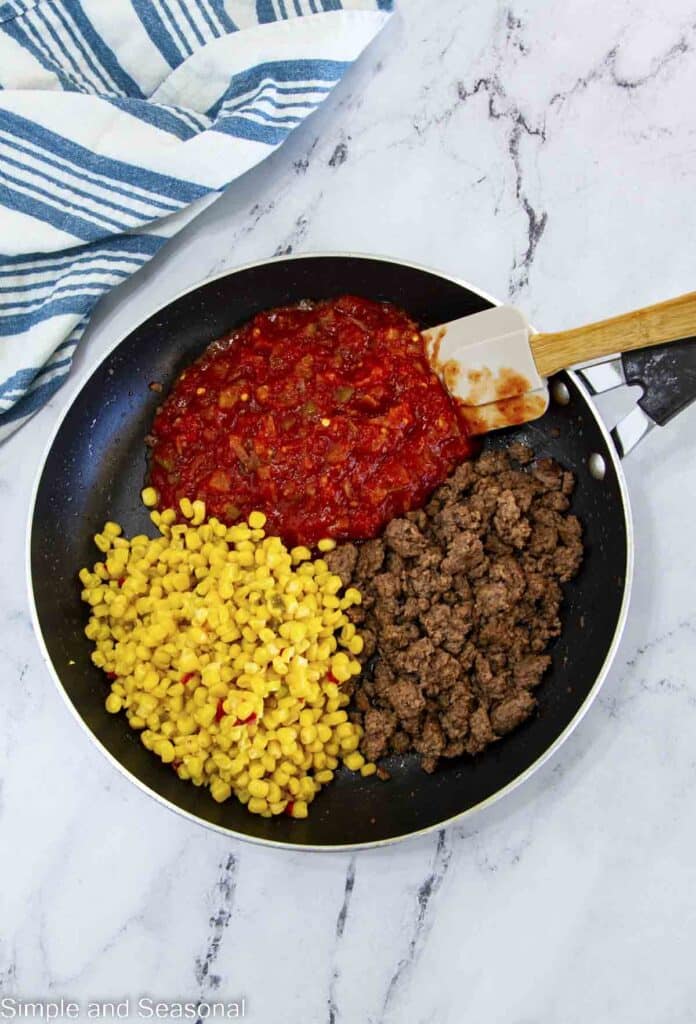 ground beef, corn and salsa in a pan