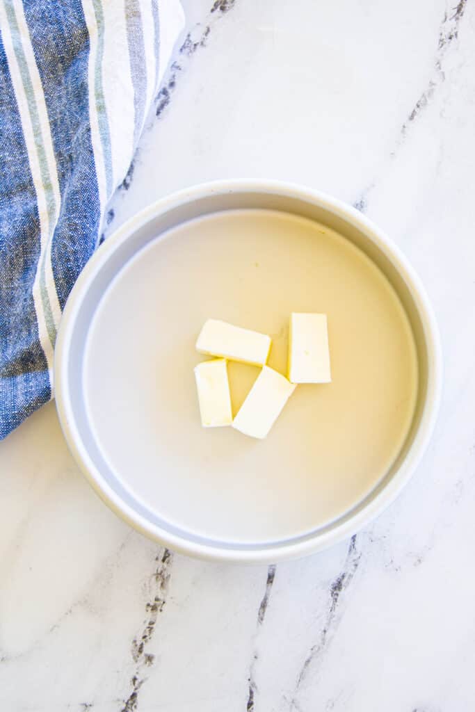butter pats in a round cake pan