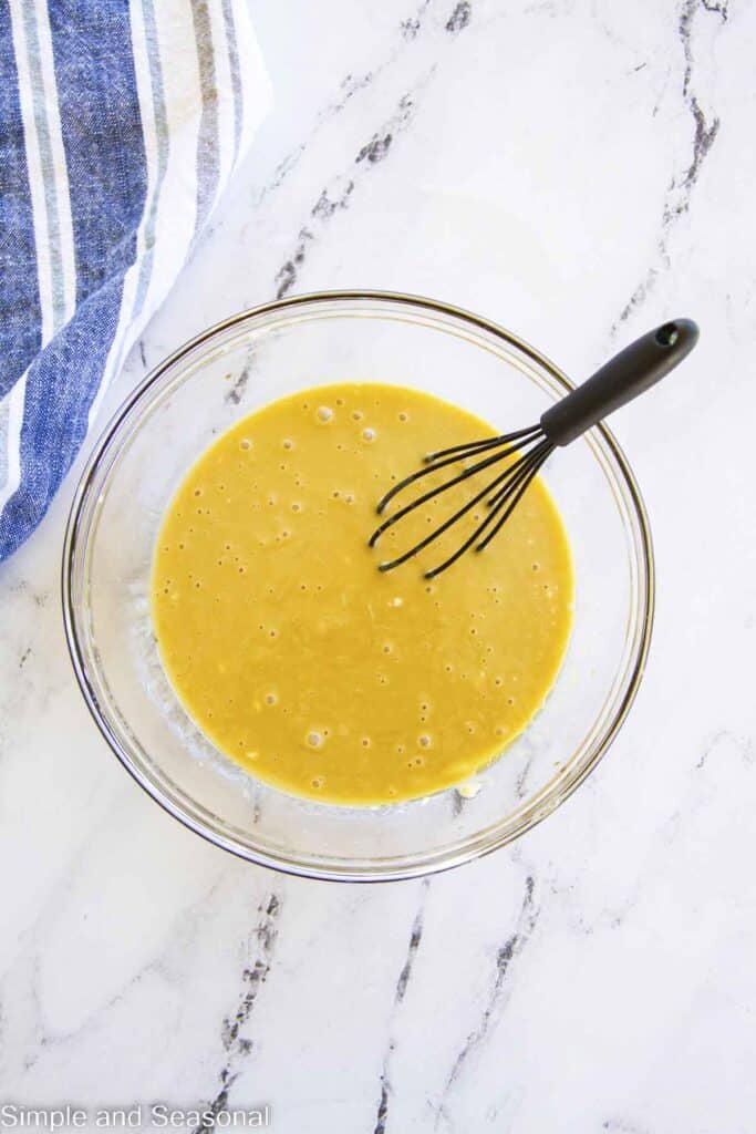 wet ingredients whisked together in a mixing bowl