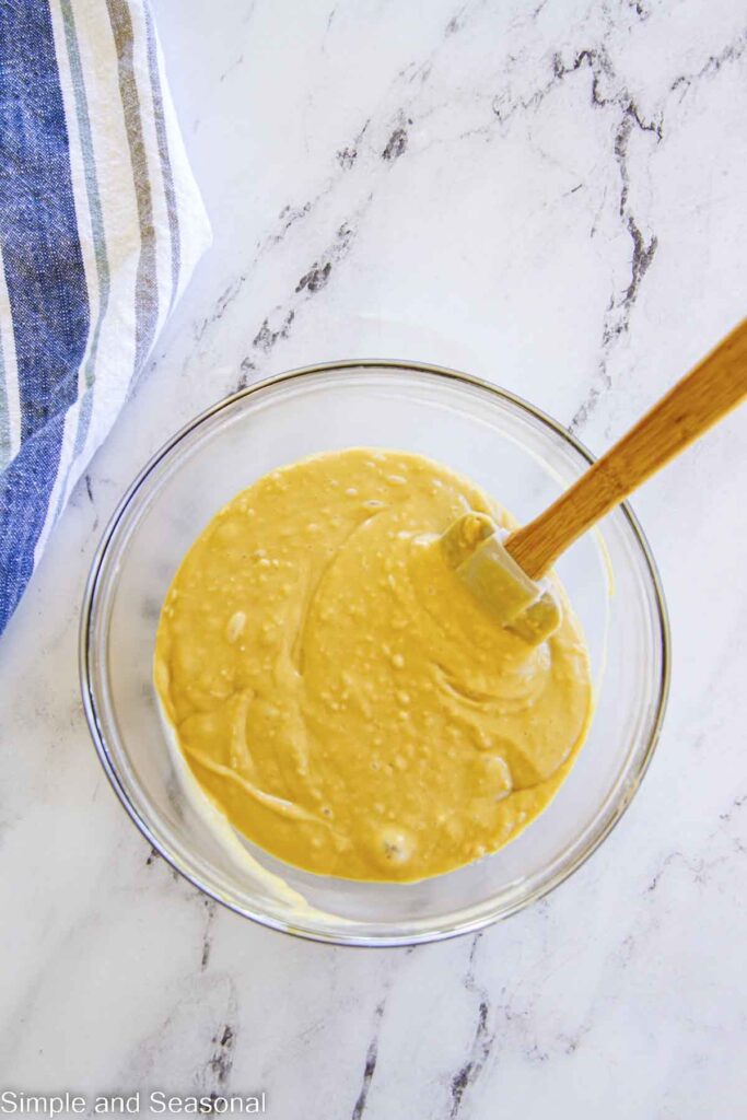 mixed cake batter in a bowl with a spatula