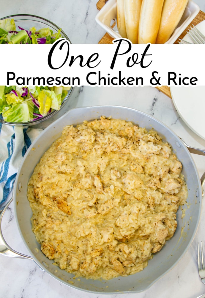 Skillet full of cooked chicken and rice, with side salad and bowl of breadsticks; text label reads: One Pot Parmesan Chicken and Rice