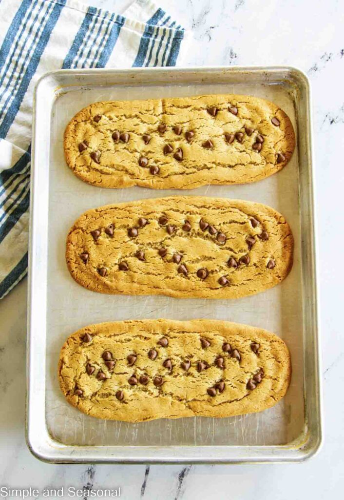 Baked cookie rectangles ready to be cut into strips
