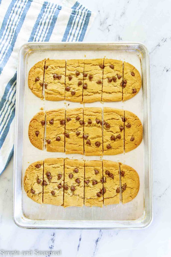 Strips of baked cookies on a pan