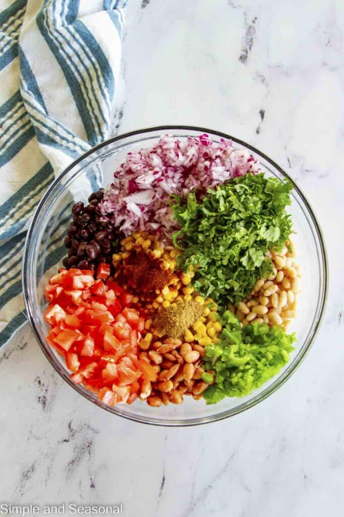 fresh ingredients for Texas caviar in a glass mixing bowl